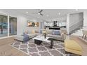 Bright living room boasts recessed lights, open floor plan, and an elegant neutral color palette at 12912 Grey Willow Dr, Raleigh, NC 27613