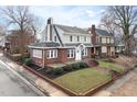 Charming two-story brick home with a manicured front yard at 201 W Trinity Ave, Durham, NC 27701