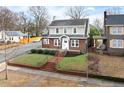 Charming two-story brick home with a manicured front yard at 201 W Trinity Ave, Durham, NC 27701
