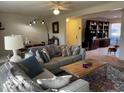 Cozy living room featuring a comfortable sectional sofa and a brick fireplace at 203 Oak Tree Dr, Chapel Hill, NC 27517