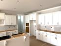 Spacious kitchen featuring white cabinets and trim and an unfinished island at 3200 Balcon Ct # 28, Angier, NC 27501