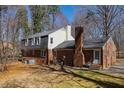 Brick home featuring an expansive yard, brick chimney, and rear entrance at 350 W Lake Trl, Mebane, NC 27302