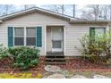 Welcoming front porch with a charming entryway and classic design at 441 Wintergreen Rd, Timberlake, NC 27583