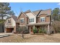 Two-story home with a mix of siding, landscaping, and an attached two car garage in need of repair at 5029 Stonewood Pines Dr, Knightdale, NC 27545