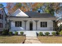 Inviting home with classic architecture, showcasing a quaint porch and manicured front yard at 704 Pender St, Rocky Mount, NC 27801
