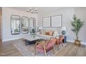 Bright living room featuring modern decor, stylish mirrors, and a comfortable seating area at 80 Hyacinth Ln # 85, Angier, NC 27501