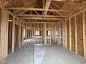 Interior framing shows a large living space with exposed wooden beams at 89 W Emily Gardens Dr, Selma, NC 27576