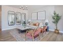 Bright living room featuring modern decor, stylish mirrors, patterned rug, and comfortable seating at 90 Hyacinth Ln # 90, Angier, NC 27501