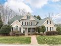 Charming brick home featuring a lush front yard with a brick pathway leading to a welcoming entrance at 101 Hedwig Ct, Cary, NC 27518