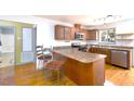 Well-equipped kitchen featuring a breakfast bar, stainless steel appliances, and ample counter space at 103 Westview Dr # D, Carrboro, NC 27510