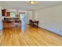 Open living area with wood floors and eat-in kitchen at 103 Westview Dr # D, Carrboro, NC 27510