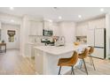 Bright kitchen with an island, stainless steel appliances, and sleek countertops for modern appeal at 121 Sacred Fire Rd, Louisburg, NC 27549