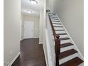 Inviting foyer with hardwood floors and a staircase leading to the upper level at 1319 Rodessa Run, Raleigh, NC 27607