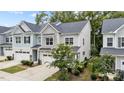 Charming two-story home featuring a two-car garage, well-maintained landscaping, and classic architectural details at 1634 Brussels Dr, Apex, NC 27502