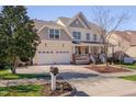 Two-story home featuring a two-car garage, well-kept lawn, and inviting curb appeal at 2006 Mill Gate Ln, Cary, NC 27519
