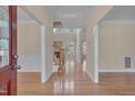 Bright foyer showcasing hardwood floors, staircase, and an open floor plan, creating an inviting entrance at 2006 Mill Gate Ln, Cary, NC 27519