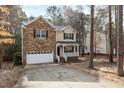 Charming two-story home with a stone facade and inviting front porch at 202 River Hills Dr, Clayton, NC 27527