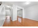 Spacious living area with hardwood floors and large windows at 202 River Hills Dr, Clayton, NC 27527