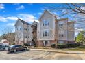 Well-kept apartment complex with reserved parking, set against a beautiful sky, offering comfortable and accessible living at 2520 Friedland Pl # 102, Raleigh, NC 27617