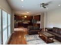 Open living room area featuring hardwood floors, recessed lighting, and seamless flow into the kitchen at 3032 Kilarney Ridge Loop, Cary, NC 27511