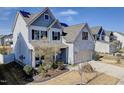 Charming two-story home with solar panels and a well-manicured lawn, inviting curb appeal at 305 Chestnut Oaks Pl, Durham, NC 27704