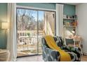 View of the outdoor balcony with seating just off the bright living room at 311 Swift Ave Ave # 202, Durham, NC 27705