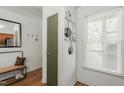 Hallway with a bench, mirror, pot rack, and a window at 311 Swift Ave Ave # 202, Durham, NC 27705
