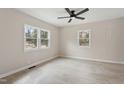 Bright bedroom with light wood flooring, neutral paint, and large windows at 312 W Union St, Hillsborough, NC 27278