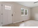 Bright entryway featuring a white front door, wood-look floors, and neutral paint at 312 W Union St, Hillsborough, NC 27278