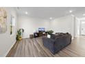 Inviting living room with hardwood floors and neutral walls at 449 Willard Woods Dr, Wendell, NC 27591