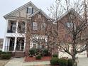 Traditional home with brick facade, upper level balcony, and manicured landscaping at 501 Liberty Rose Dr, Morrisville, NC 27560
