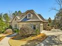 Well maintained stone home featuring a garden and side-entry garage at 601 Golfers Vw, Pittsboro, NC 27312
