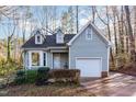 Charming home with a well-manicured front yard, attached garage, and inviting curb appeal at 6800 Chamonix Pl, Raleigh, NC 27613