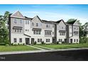 New construction townhomes displaying a sidewalk lined with landscaping and gray and white exterior at 1032 Zelkova Lane, Chapel Hill, NC 27517