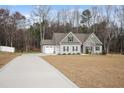 Attractive one-story home with an attached garage and a paved driveway at 203 Mitchell Manor Dr, Angier, NC 27501