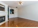 Bright living room with hardwood floors, fireplace and stylish light fixtures at 205 Cedar Elm Rd, Durham, NC 27713