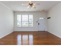 Inviting front room with hardwood floors, a front door, and bright windows at 205 Cedar Elm Rd, Durham, NC 27713