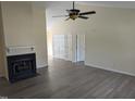 Bright living room with high ceilings, fireplace, neutral walls and modern wood-look floors at 212 Davis Farm Dr, Selma, NC 27576