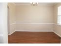 Spacious dining room with hardwood floors, and bright window at 212 Liberty Rose Dr, Morrisville, NC 27560