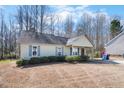 Charming single-story home features a cozy front porch and blue shutters at 220 Courtland Dr, Angier, NC 27501