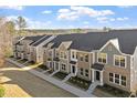 Aerial perspective of new townhome community, showing the layout, design, and neighborhood features at 223 Frosted Iris Lane Ln # 176, Garner, NC 27529