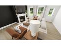 Inviting living room featuring a fireplace, comfortable seating, and bright natural light at 301 Beacon Dr, Pittsboro, NC 27312
