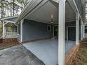 Carport area offering convenient covered parking and access to additional storage at 314 Mill Creek Dr, Fuquay Varina, NC 27526