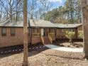 Charming brick home features a welcoming entrance with freshly mulched garden beds at 3217 Stoneyford Ct, Raleigh, NC 27603