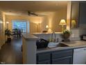 Open floor plan kitchen with views into the dining and living areas, perfect for entertaining at 3710 Pardue Woods Pl # 103, Raleigh, NC 27606
