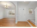 Bright entryway with wood floors and an open layout, leading to living spaces at 4308 Brynwood Ave, Durham, NC 27713