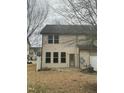 View of the backyard features a small patio area, grass and vinyl siding at 4469 Middletown Dr, Wake Forest, NC 27587