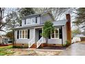 Traditional two-story home featuring classic architecture, tidy landscaping, and inviting front porch at 4604 Sweet Melody Ln, Knightdale, NC 27545