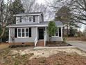 Charming two-story home with gray siding and black shutters at 4604 Sweet Melody Ln, Knightdale, NC 27545