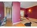 Inviting living room with hardwood floors and modern light fixtures at 4709 Delta Lake Dr, Raleigh, NC 27612